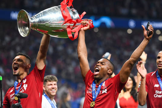Daniel Sturridge of Liverpool celebrates with the trophy