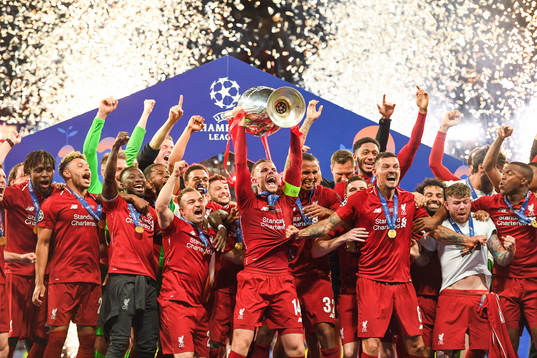 Jordan Henderson of Liverpool celebrate with the trophy