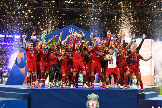 Jordan Henderson of Liverpool celebrate with the trophy