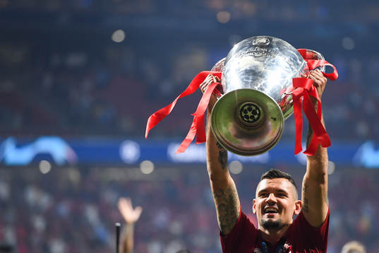 Dejan Lovren of Liverpool celebrate with the trophy