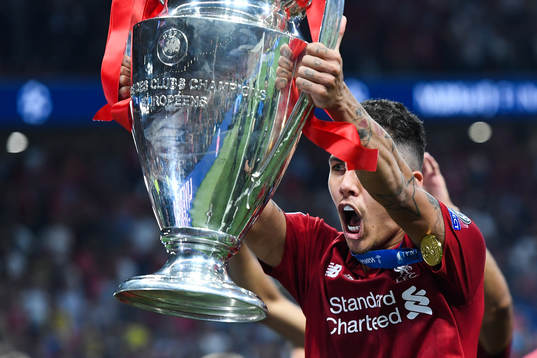 Roberto Firmino of Liverpool celebrates with the trophy