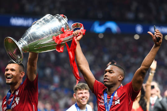 Daniel Sturridge of Liverpool celebrates with the trophy