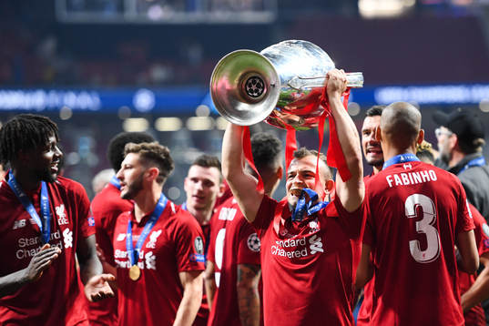 Xherdan Shaqiri of Liverpool celebrate with the trophy