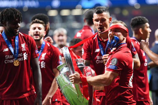 Xherdan Shaqiri of Liverpool celebrate with the trophy