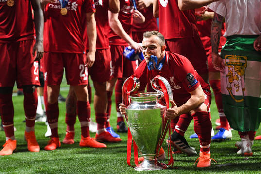 Xherdan Shaqiri of Liverpool celebrate with the trophy