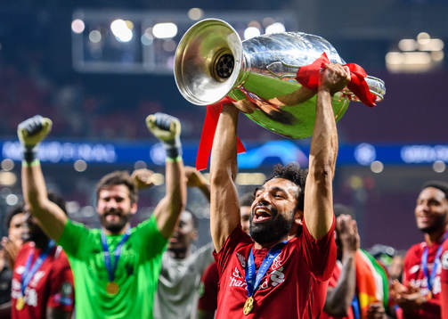Mohamed Salah of Liverpool celebrates with the throphy