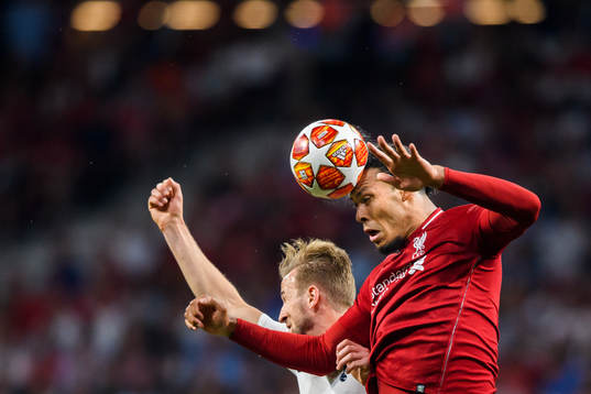 Virgil van Dijk of Liverpool and Harry Kane of Tottenham