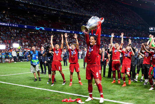 Virgil van Dijk of Liverpool celebrates with the throphy