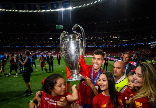 Roberto Firmino of Liverpool celebrates with the throphy