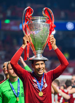 Virgil van Dijk of Liverpool celebrates with the throphy