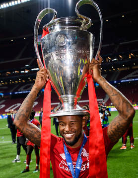 Georginio Wijnaldum of Liverpool celebrate with the trophy