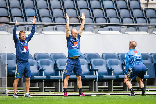 Sebastian Larsson and Per Karlsson follow instructions from
