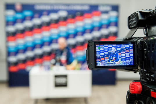 A videocamera filming Lars Lagerbäck, head coach of Norway