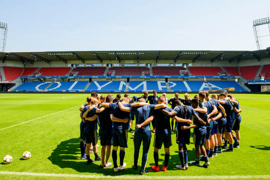 The team gathers