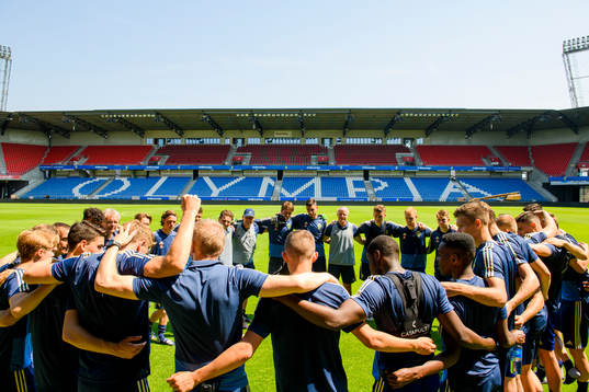 The team gathers
