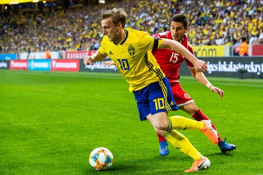 Emil Forsberg of Sweden and Ryan Fenech of Malta