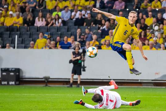 Ludwig Augustinsson of Sweden and goalkeeper Henry Bonello