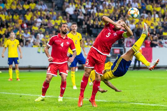 Robin Quaison of Sweden with a bicycle kick and Ferdinando