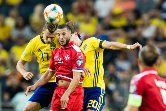 Viktor Claesson and Kristoffer Olsson competes for the ball