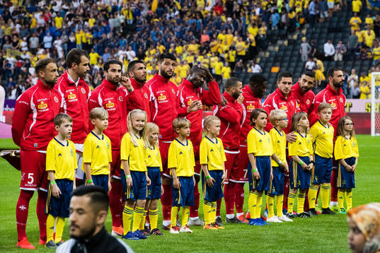 Players of Malta with mascots