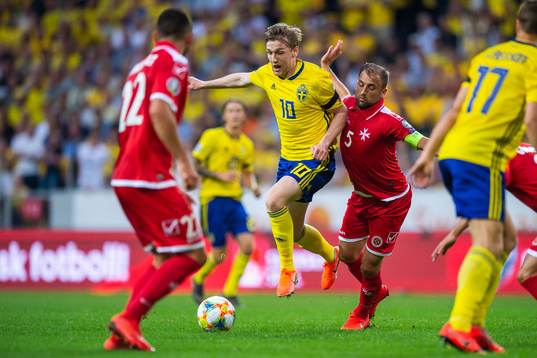Emil Forsberg of Sweden and Ferdinando Apap of Malta