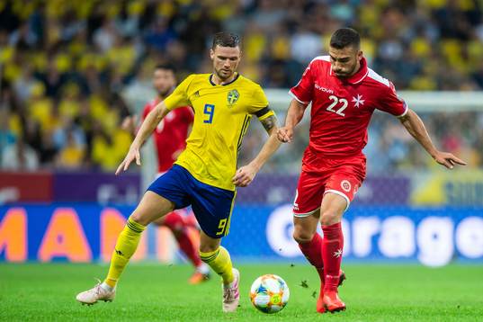Marcus Berg of Sweden and Alfred Effiong of Malta