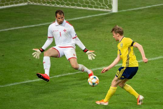 Emil Forsberg of Sweden and goalkeeper Henry Bonello of
