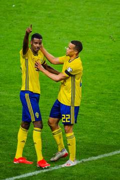 Alexander Isak and Robin Quaison of Sweden celebrate
