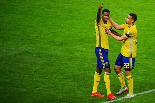 Alexander Isak and Robin Quaison of Sweden celebrate