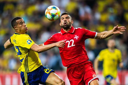 Robin Quaison of Sweden and Alfred Effiong of Malta