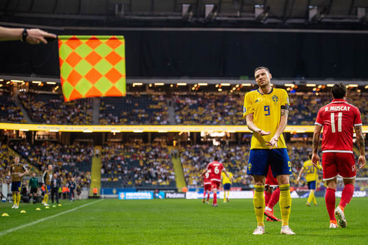Marcus Berg of Sweden reacts to the assistant referee