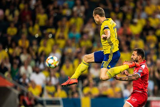 Viktor Claesson of Sweden scores 2-0 behind goalkeeper