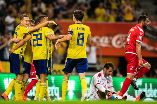 Viktor Claesson of Sweden celebrate with Robin Quaison and