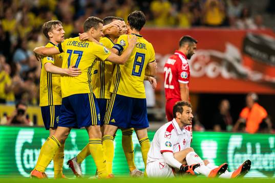 Viktor Claesson of Sweden celebrate with Robin Quaison and