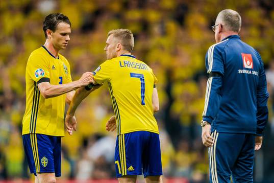 Marcus Berg changes with Sebastian Larsson of Sweden