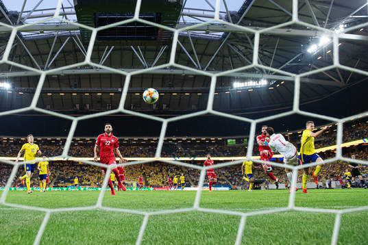 Viktor Claesson of Sweden scores 2-0 behind goalkeeper