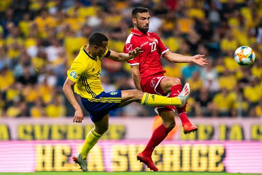 Robin Quaison of Sweden and Alfred Effiong of Malta