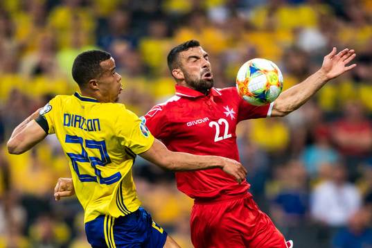 Robin Quaison of Sweden and Alfred Effiong of Malta