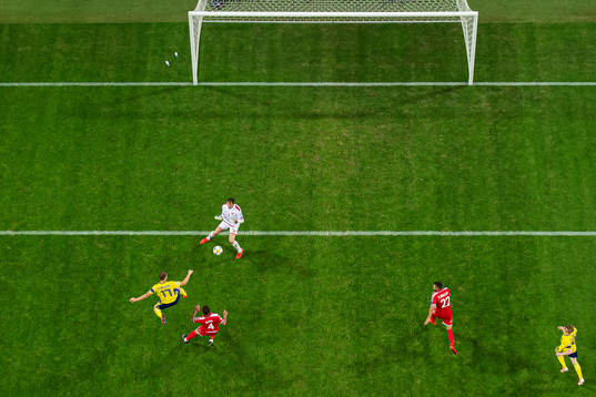 Viktor Claesson of Sweden scores 2-0 behind goalkeeper