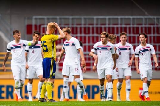 Nils Fröling of Sweden looks dejected while Lars Olden