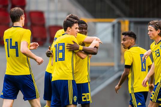 Benjamin Mbunga Kimpioka of Sweden celebrate with teammates