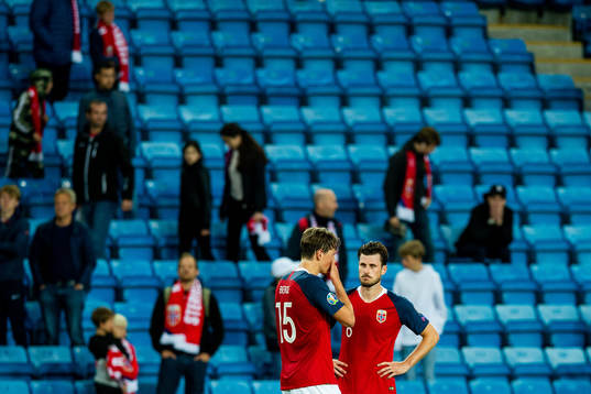 Sander Berge and Håvard Nordtveit of Norway look dejected