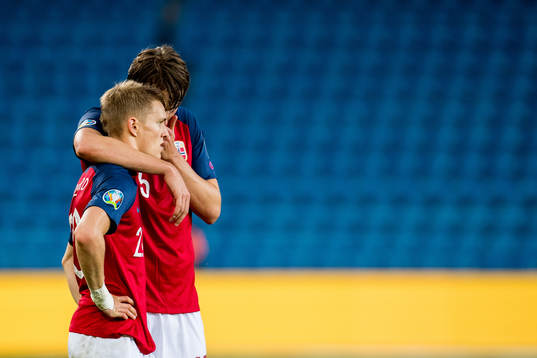 Martin Ødegaard and Sander Berge of Norway looks dejected