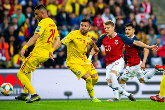 Alin Tosca of Romania and Martin Ødegaard of Norway