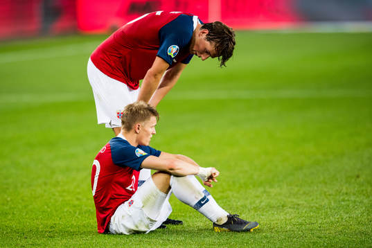 Sander Berge and Martin Ødegaard of Norway looks dejected
