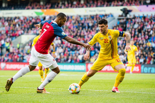 Joshua King of Norway and Cristian Sapunaru of Romania