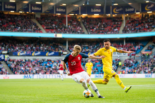 Martin Ødegaard of Norway and Alin Tosca of Romania