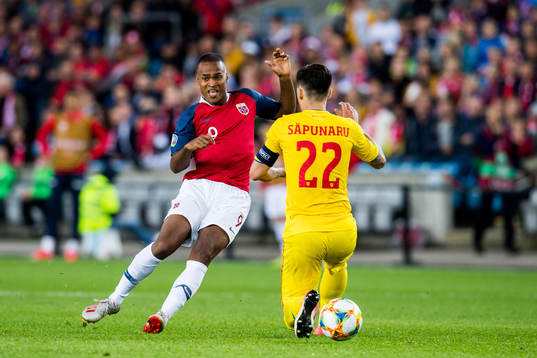 Ola Kamara of Norway and Cristian Sapunaru of Romania
