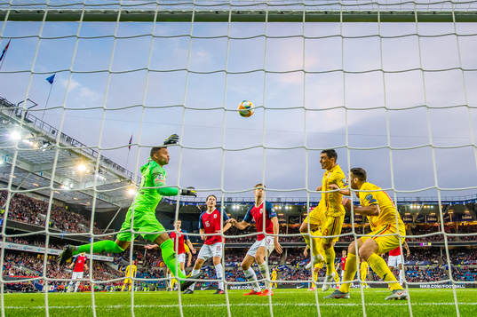 Claudiu Keseru of Romania scores the 2-1 goal