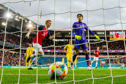 Martin Ødegaard of Norway and goalkeeper Ciprian